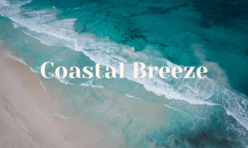 Ocean waves crashing on sand with text coastal breeze