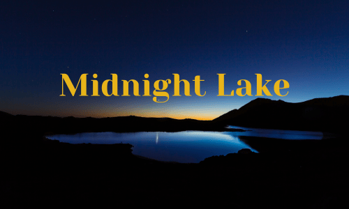 Lake reflecting night sky with text midnight lake