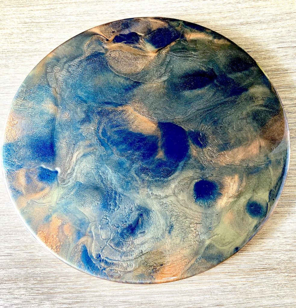 Large wood lazy susan with resin coating inspired by the dancing embers in a campfire.