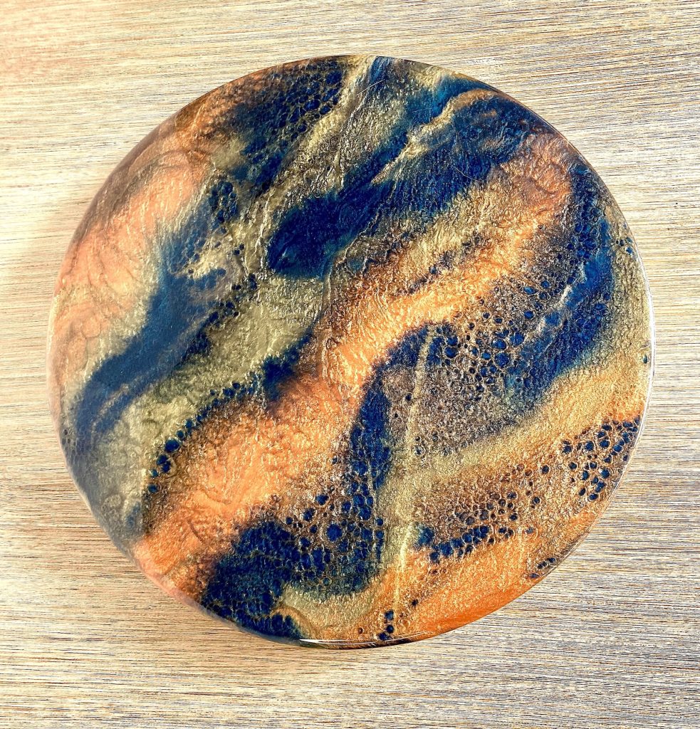 Medium wood lazy susan with resin coating inspired by the dancing embers in a campfire.