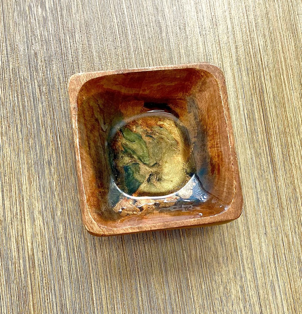 Wood trinket dish with resin coating inspired by the dancing embers in a campfire.