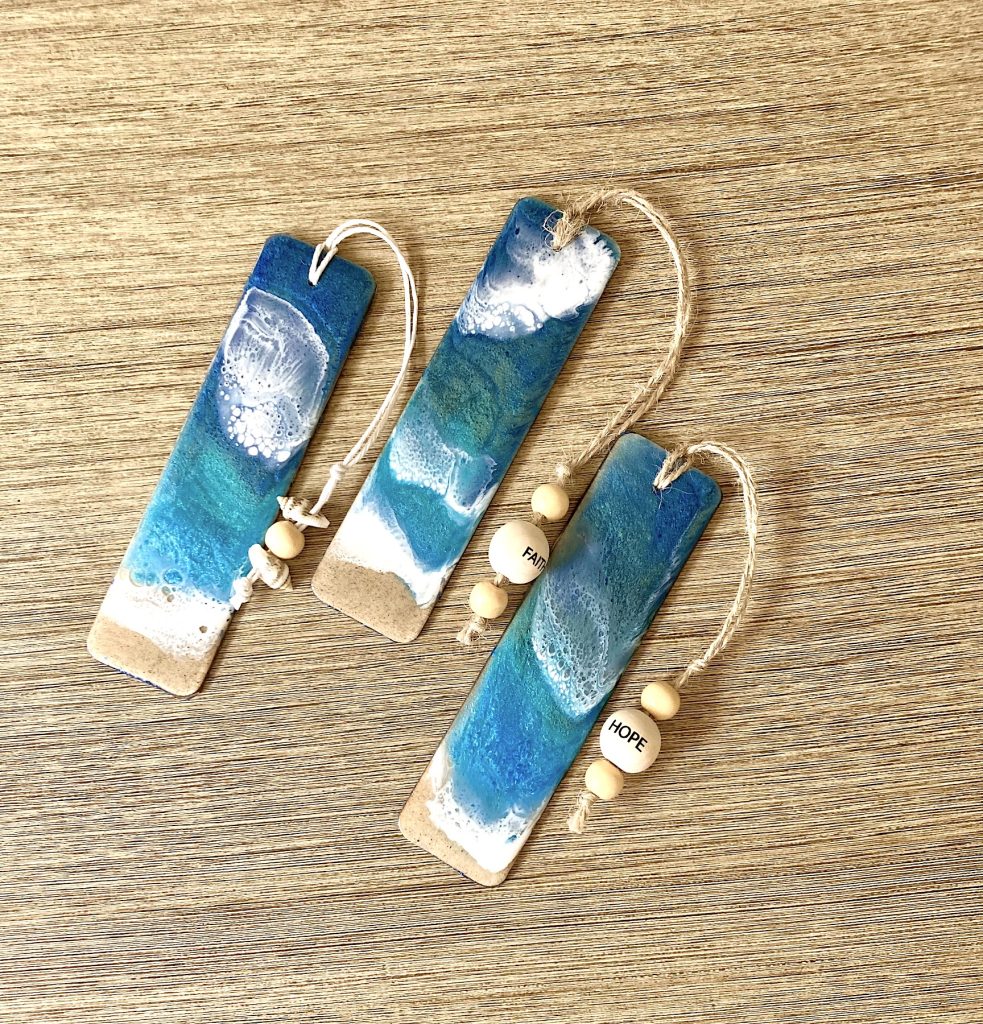 Wooden bookmark with coastal resin, twine and beads.