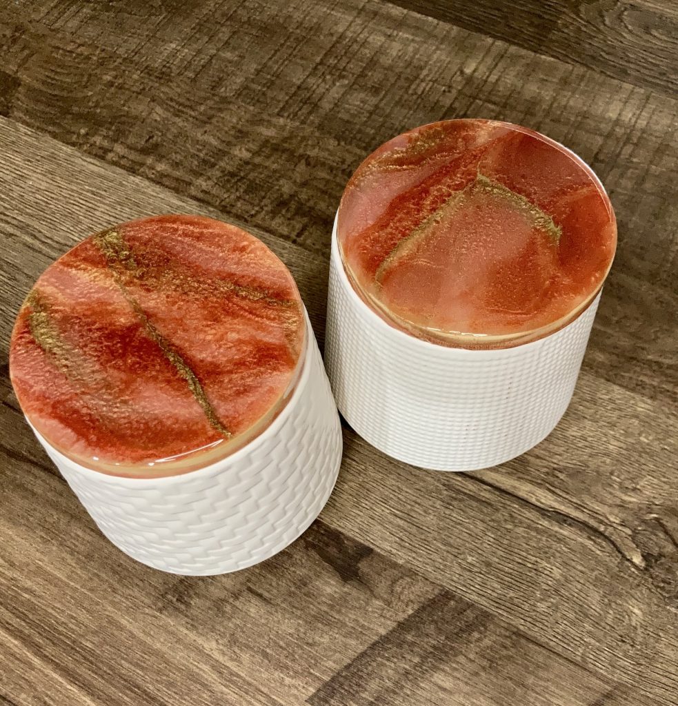 Set of two ceramic canisters with resin coated lids