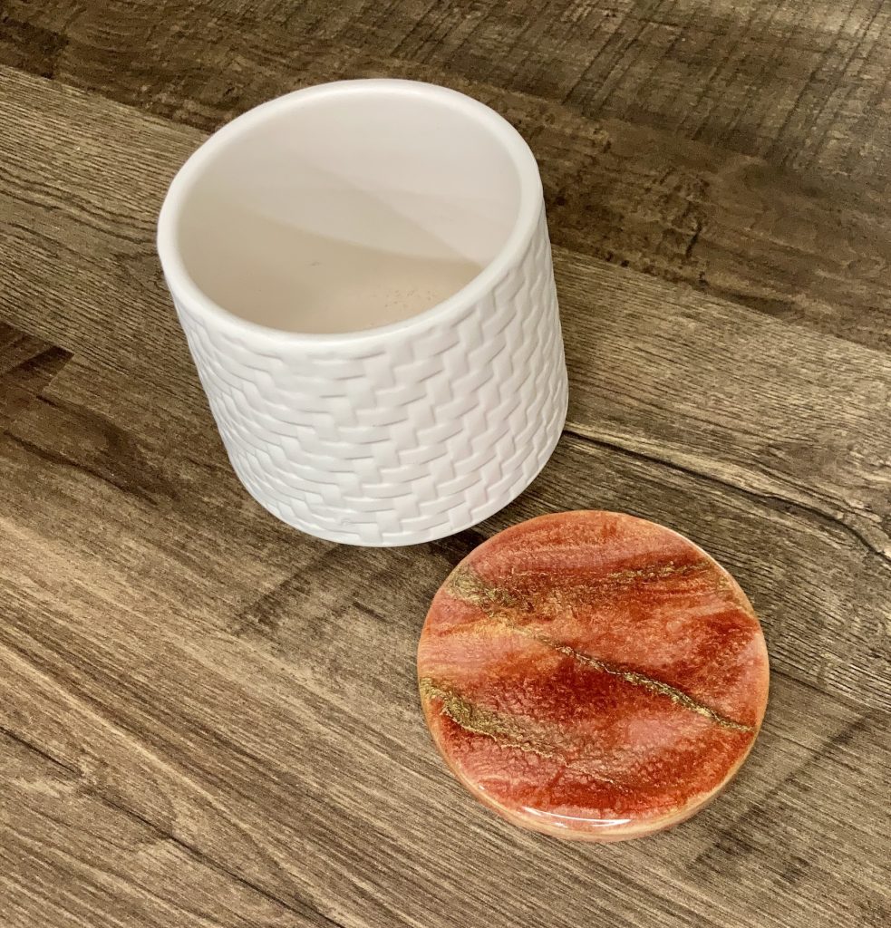 Ceramic canister with a basket weave and a resin coated lid